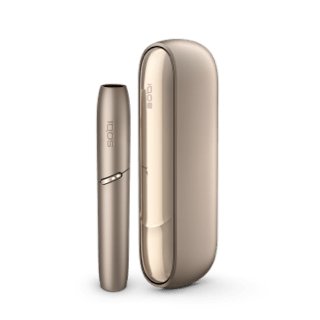 A golden IQOS 3 DUO and holder
