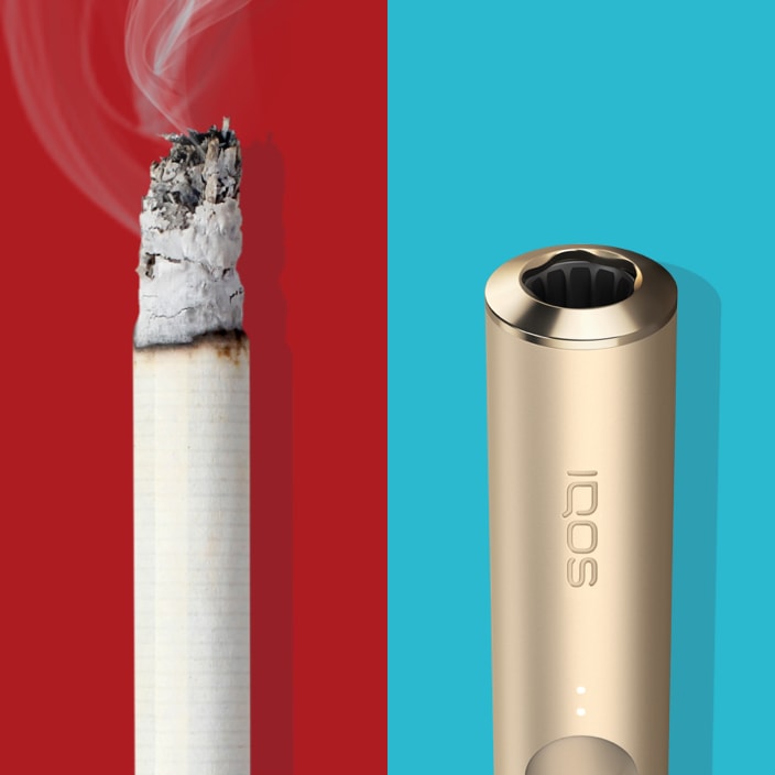 Extremo de un cigarrillo encendido comparado con una unidad de tabaco TEREA en un dispositivo IQOS ILUMA.